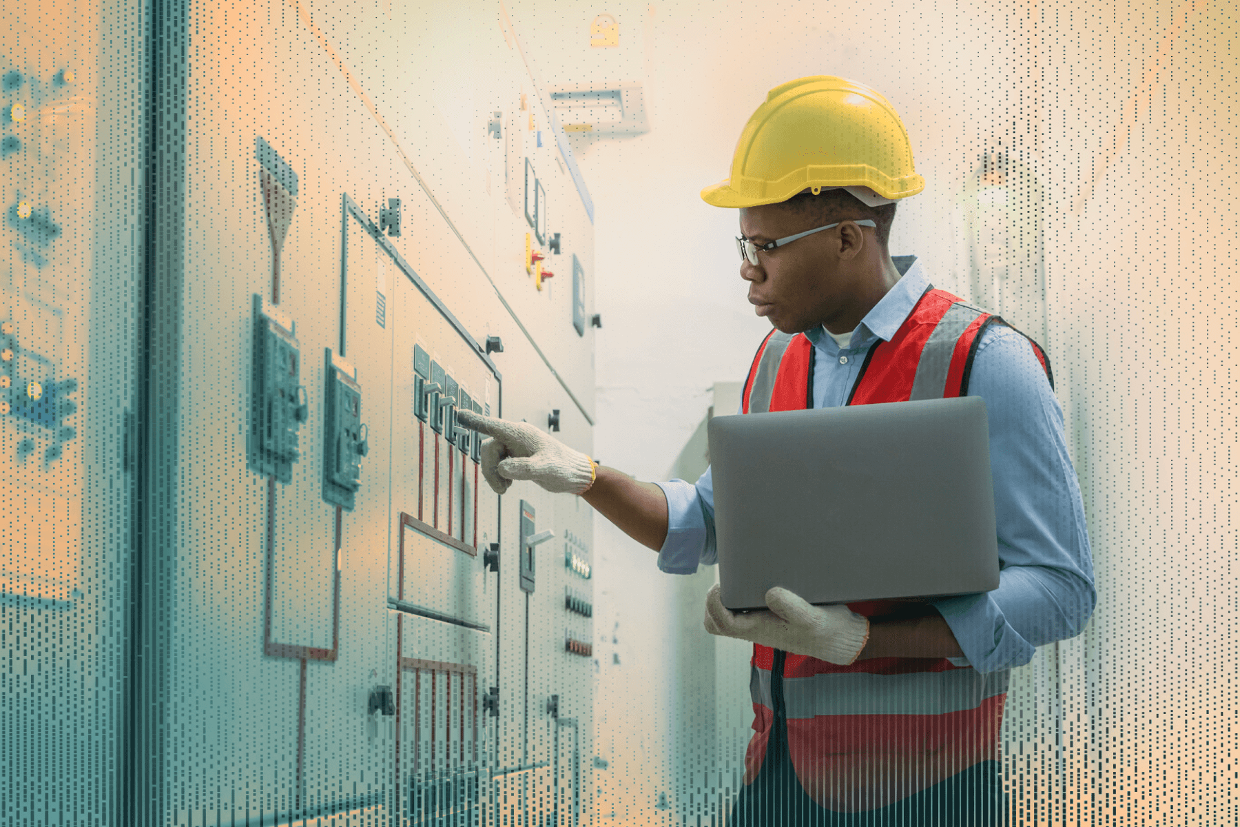 A technician in safety gear inspects a critical infrastructure control panel with a laptop in hand.