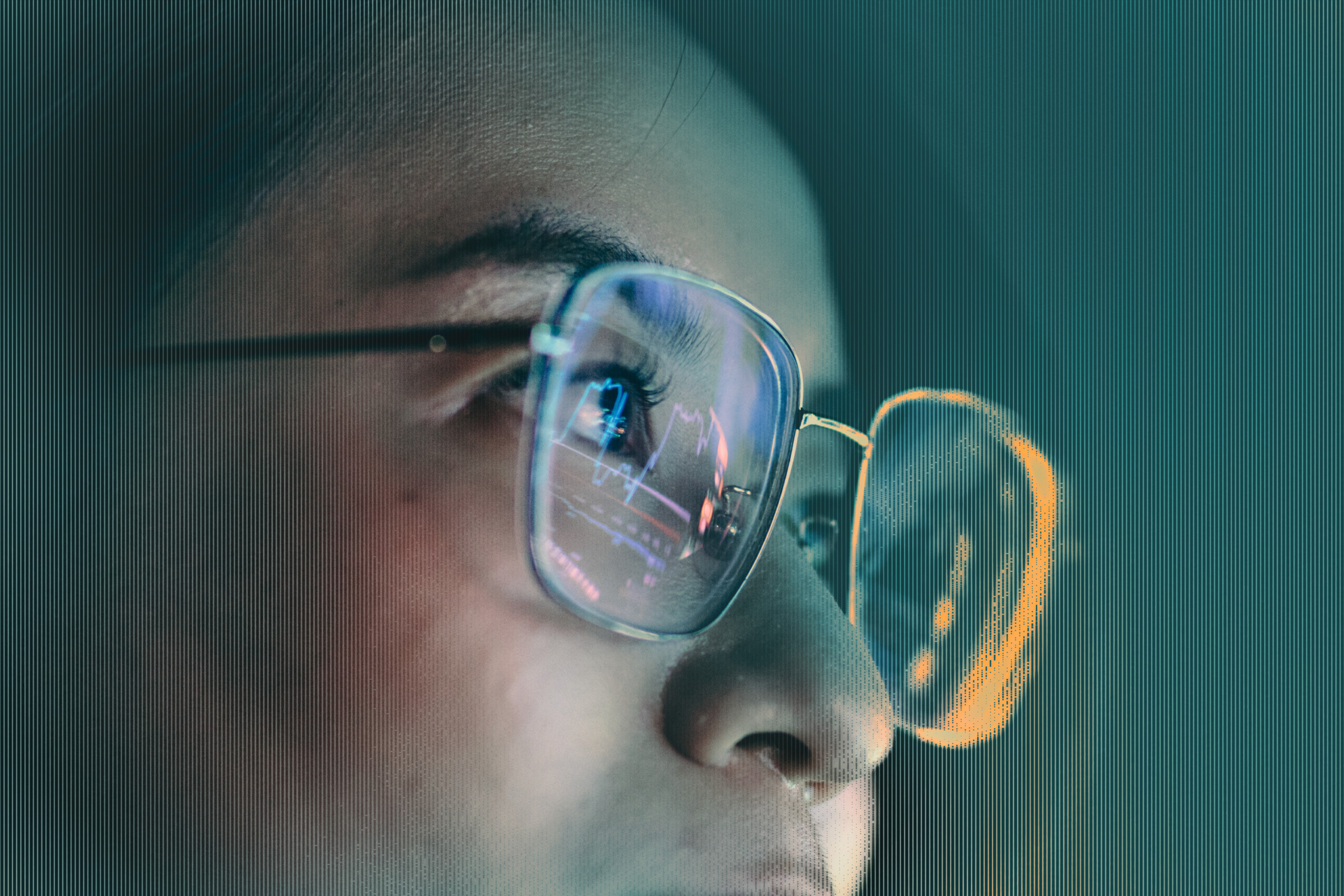 Close-up of a woman wearing glasses with a digital health monitor reflected in the lenses.