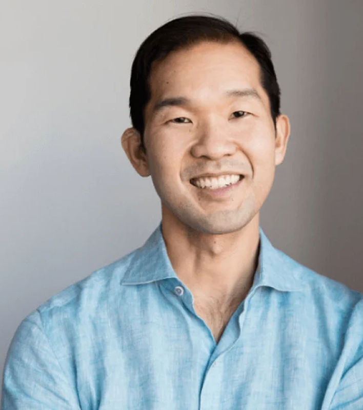 Jon Sakoda, a leader at Censys, smiles in a light blue shirt against a neutral background.